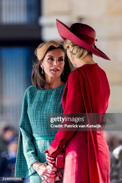 Queen Maxima of The Netherlands welcomes Queen Letizia of Spain with an official welcome ceremony at the Royal Palace on April 17, 2024 in Amsterdam,...