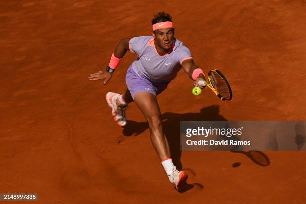 Rafa Nadal of Spain plays a forehand against Alex de Minaur of Australia during their match of day three of the Barcelona Open Banc Sabadell at Real...