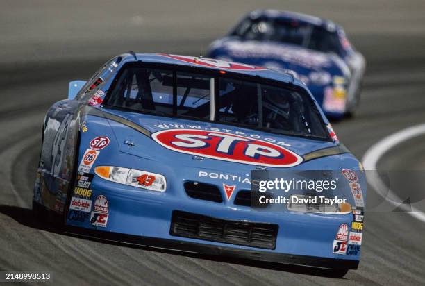 John Andretti from the United States driving the STP Petty Enterprises Pontiac Grand Prix during the 1999 NASCAR Winston Cup Series Brickyard 400...