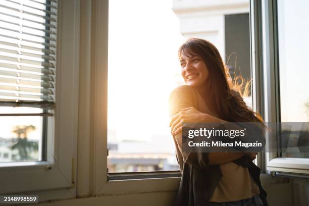 the setting sun is warming my back - self-love stock pictures, royalty-free photos & images