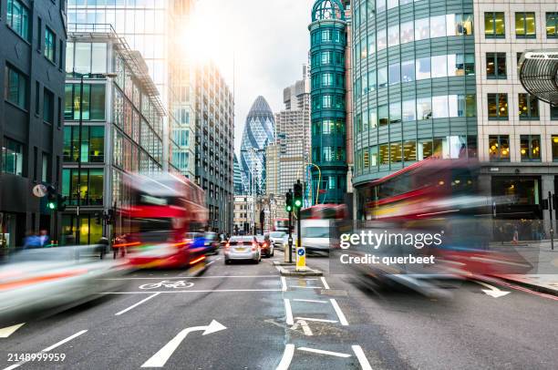 busy street in london with buses - london car stock pictures, royalty-free photos & images