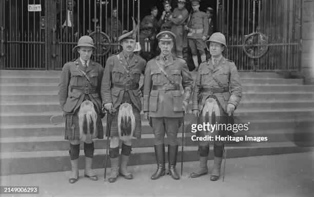 Lieut. Seely, Lt. Col. P.A. Guthrie, Col. J.S. Denis [i.e. Dennis], Capt. Black, July 1917. Officers of Canadian Highlander regiments standing...
