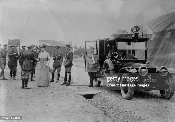 Queen Mary visits aerodrome shed, 5 Jul 1917. Queen Mary of Teck leaving the aerodrome at Royal Flying Corps Headquarters at St. Omer, France on July...