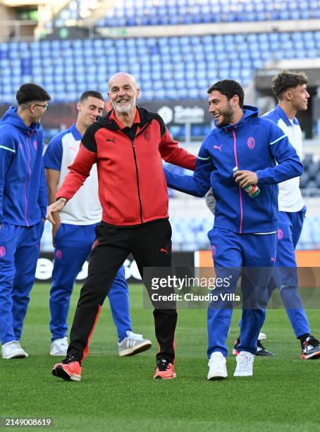 Head coach AC Milan Stefano Pioli and Davide Calabria of AC Milan look on during a pitch inspection before the UEFA Europa League 2023/24...