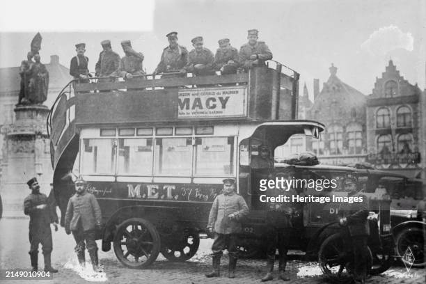 Captured English autobus used by Germans in Belg. [i.e., Belgium], between 1914 and circa 1915. German soldiers in a captured English bus in Market...