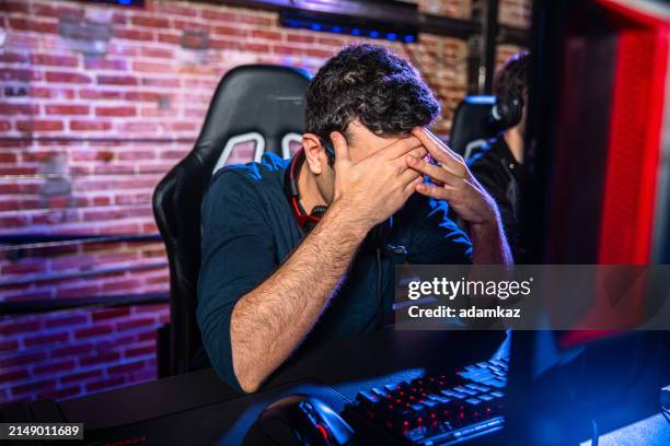 young man reacts after losing an esports match game - esports stock pictures, royalty-free photos & images