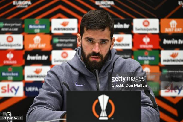 Alisson Becker of Liverpool FC talks to the media during the UEFA Europa League 2023/24 quarter-final second leg press conference at Gewiss Stadium...