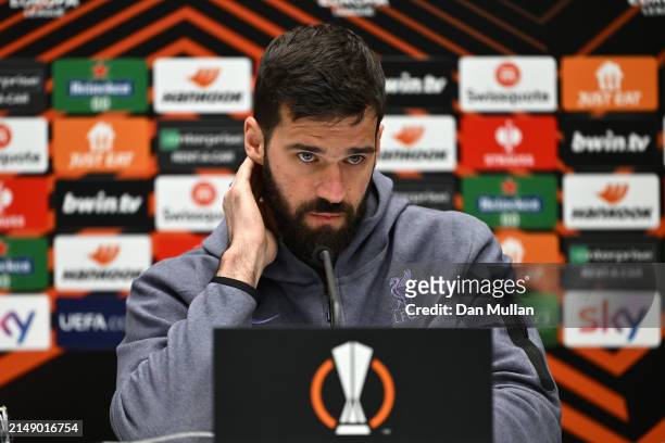 Alisson Becker of Liverpool FC talks to the media during the UEFA Europa League 2023/24 quarter-final second leg press conference at Gewiss Stadium...