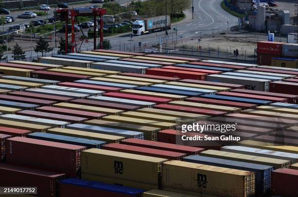 In this aerial view shipping containers lie stacked at Hamburg Port on April 17, 2024 in Hamburg, Germany. The International Monetary Fund has...
