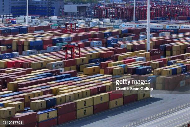 In this aerial view shipping containers lie stacked at Hamburg Port on April 17, 2024 in Hamburg, Germany. The International Monetary Fund has...