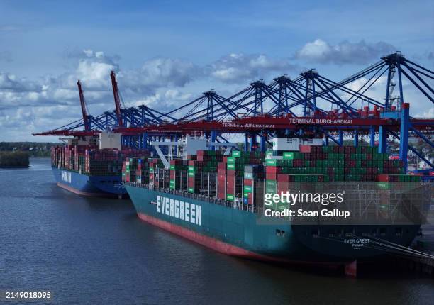 In this aerial view cargo ships, including the Evergeen Ever Greet, lie laden with shipping containers at Hamburg Port on April 17, 2024 in Hamburg,...