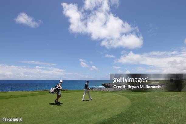 Nicolai Højgaard of Denmark and his caddie walk off the ninth tee during a practice round prior to the Corales Puntacana Championship at Puntacana...