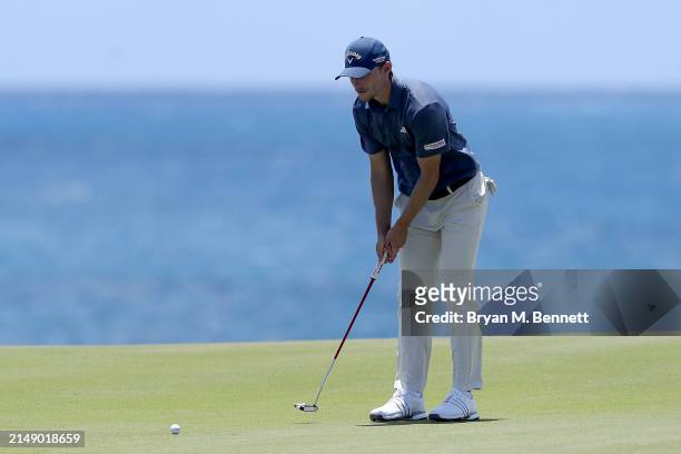 Nicolai Højgaard of Denmark looks over a putt from the eighth green during a practice round prior to the Corales Puntacana Championship at Puntacana...