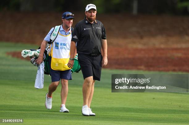 Shane Lowry of Ireland in action with his caddie Darren Reynolds during the pro-am prior to the RBC Heritage at Harbour Town Golf Links on April 17,...