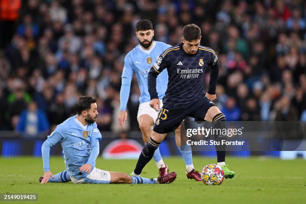 Federico Valverde of Real Madrid is challenged by Bernardo Silva of Manchester City during the UEFA Champions League quarter-final second leg match...