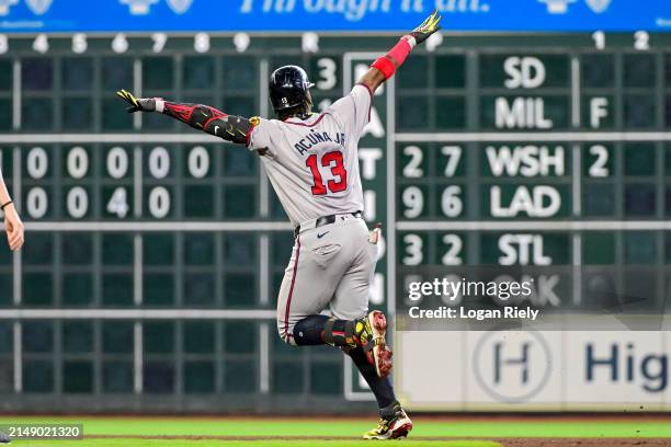 Ronald Acuña Jr. #13 of the Atlanta Braves celebrates after hitting a solo home run in the fifth inning against the Houston Astros at Minute Maid...