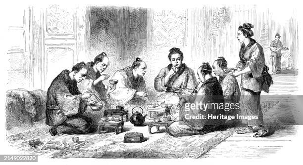 Japanese party at meals, 1864. An '...Illustration of the daily life of the Japanese people, from a sketch by Mr. Wirgman, our Special Artist. It...