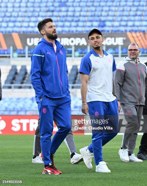 Olivier Giroud and Noah Okafor of AC Milan look on during a pitch inspection before the UEFA Europa League 2023/24 quarter-final second leg training...
