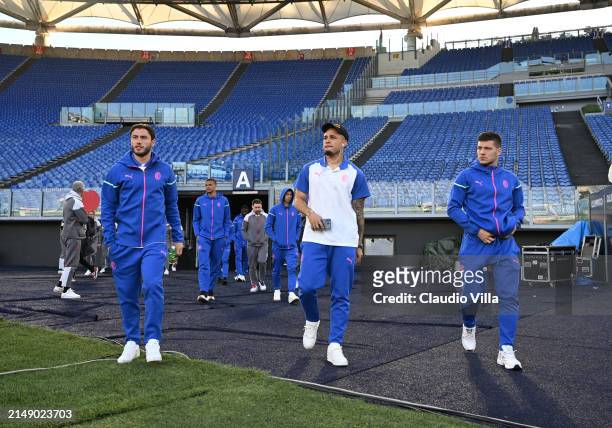 Davide Calabria, Luka Jovic and Noah Okafor of AC Milan look on during a pitch inspection before the UEFA Europa League 2023/24 quarter-final second...