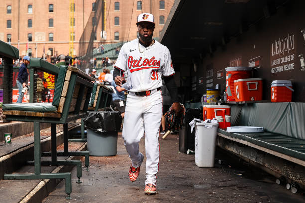 Cedric Mullins of the Baltimore Orioles reacts in the dugout after hitting the game-winning two-run home run against the Minnesota Twins during the...