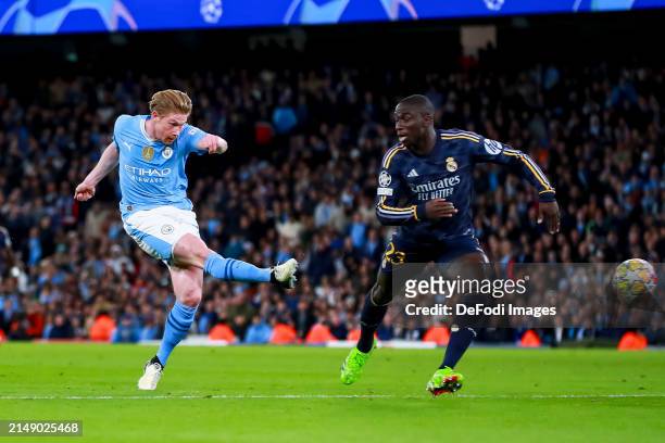 Kevin De Bruyne of Manchester City shoots next to Ferland Mendy of Real Madrid during the UEFA Champions League quarter-final second leg match...
