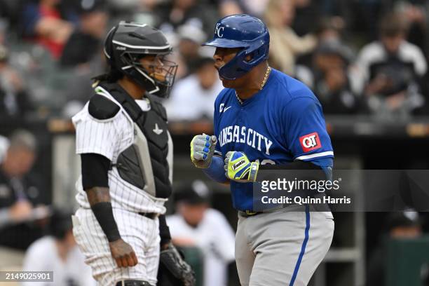 Salvador Perez of the Kansas City Royals reacts after a two-run home run in the eighth inning during game one of a doubleheader against the Chicago...