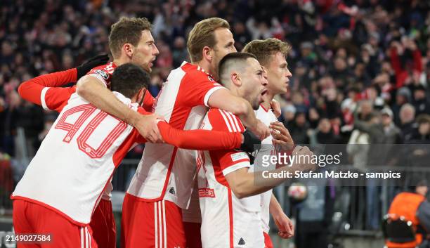 Joshua Kimmich of Bayern Muenchen celebrates as he scores the goal 1:0 with Harry Kane of Bayern Muenchen Raphael Guerreiro of Bayern Muenchen during...