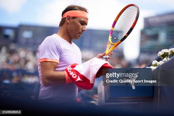 Rafael Nadal of Spain towels down against Alex de Minaur of Australia in the second round during day three of the Barcelona Open Banc Sabadell at...