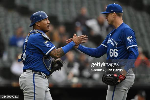 Salvador Perez and James McArthur of the Kansas City Royals celebrate after the 4-2 win in game one of a doubleheader against the Chicago White Sox...