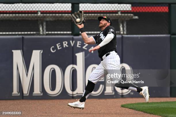 Robbie Grossman of the Chicago White Sox catches a fly ball on the warning tracks in the first inning during game two of a doubleheader against the...