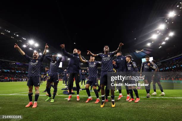 Daniel Carvajal, Ferland Mendy, Joselu, Lucas Vazquez, Vinicius Junior and Jude Bellingham of Real Madrid celebrate following the team's victory in...