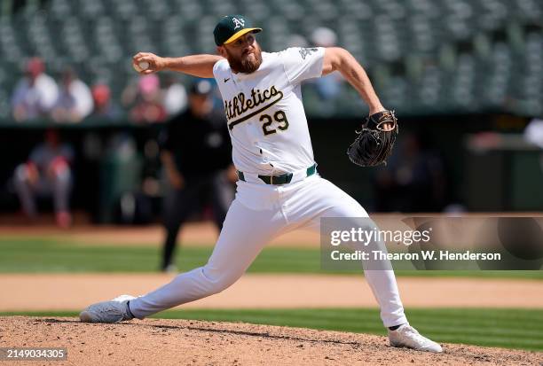 Austin Adams of the Oakland Athletics pitches against the St. Louis Cardinals in the top of the seventh inning on April 17, 2024 at the Oakland...