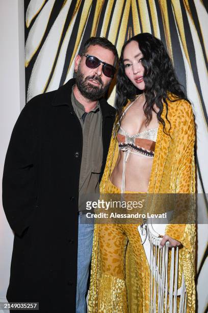 Fausto Puglisi and Tamara Kalinic attends the "Ray Of Gold" Home Collection presentation cocktail at Condé Nast Bistrot on April 17, 2024 in Milan,...