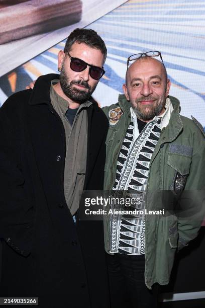 Fausto Puglisi and a Guest attend the "Ray Of Gold" Home Collection presentation cocktail at Condé Nast Bistrot on April 17, 2024 in Milan, Italy.