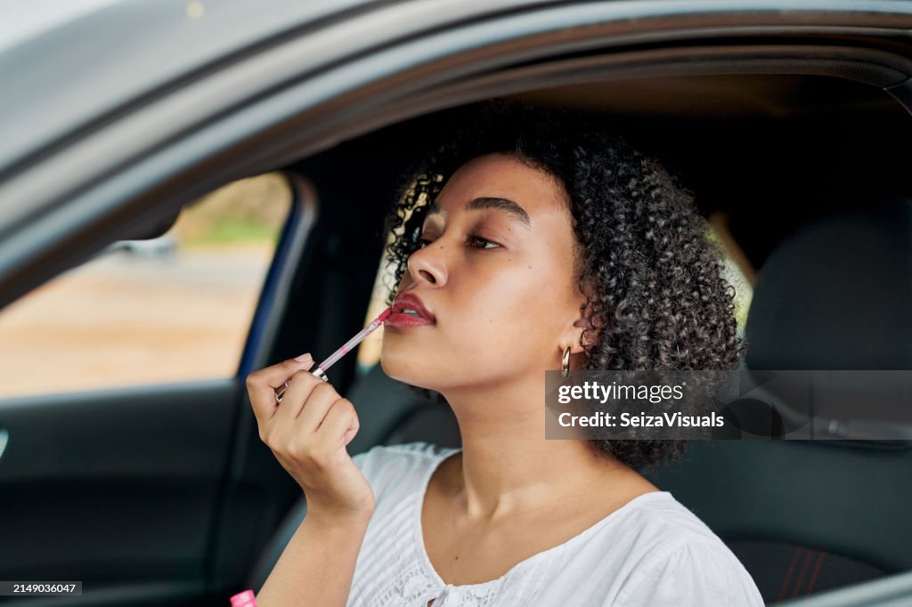 Makeup, mirror or woman in car for lipstick application, gloss or beauty for road trip adventure. Transport, travel or female driver with mouth, lips or shine cosmetics on morning, journey or commute