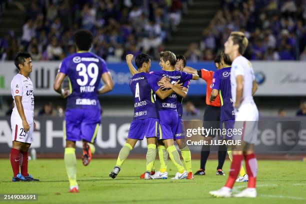 Sho Sasaki of Sanfrecce Hiroshima celebrates with teammates after scoring the team's second goal during the J.League J1 match between Sanfrecce...