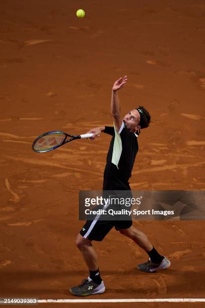 Daniel Altmaier of Germany serves against Arthur Fils of France in the second round during day three of the Barcelona Open Banc Sabadell at Real Club...
