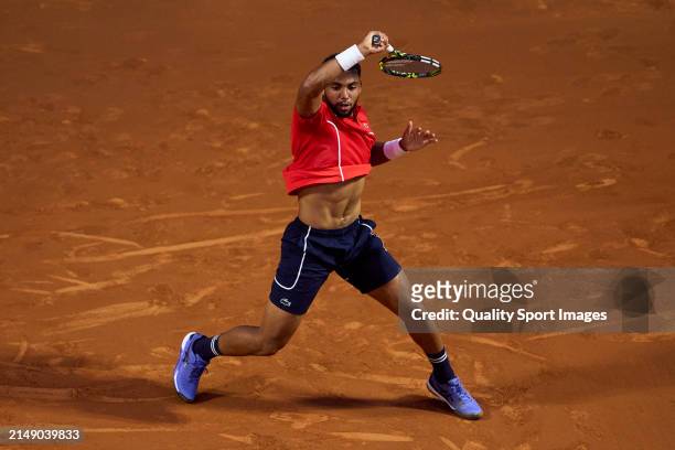 Arthur Fils of France plays a forehand shot against Daniel Altmaier of Germany in the second round during day three of the Barcelona Open Banc...