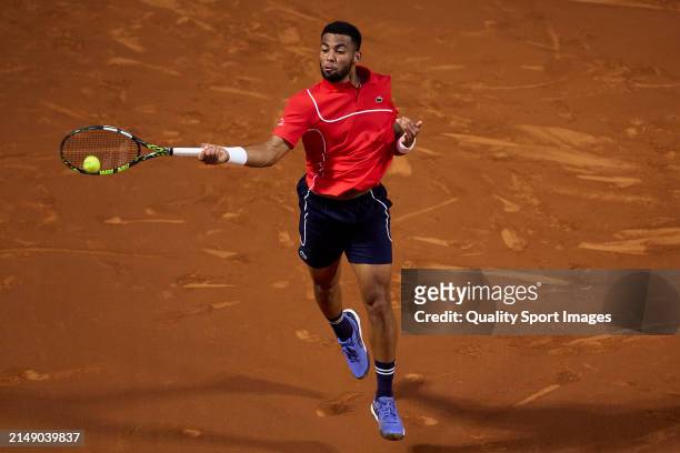 Arthur Fils of France plays a forehand shot against Daniel Altmaier of Germany in the second round during day three of the Barcelona Open Banc...