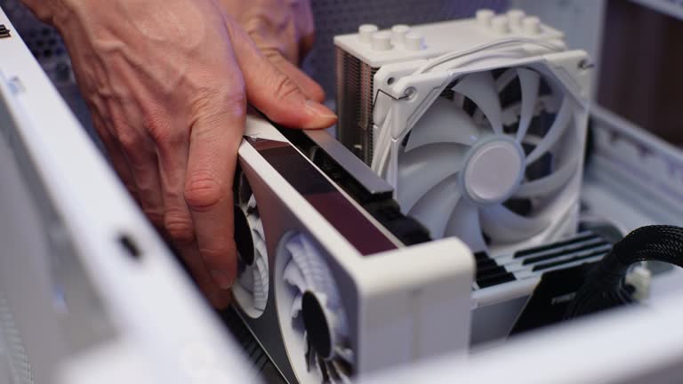 https://media.gettyimages.com/id/2149040646/video/closeup-of-unrecognizable-master-repairman-assembling-pc-system-unit-install-video-card-of.jpg?b=1&s=640x640&k=20&c=iDg_Q6aNRu4D4GvDriWaMqoZ7hct9YFPQYYCjMCuyvs=
