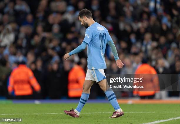 Dejected Bernardo Silva of Manchester City walks back to the centre circle after missing his penalty during the UEFA Champions League quarter-final...