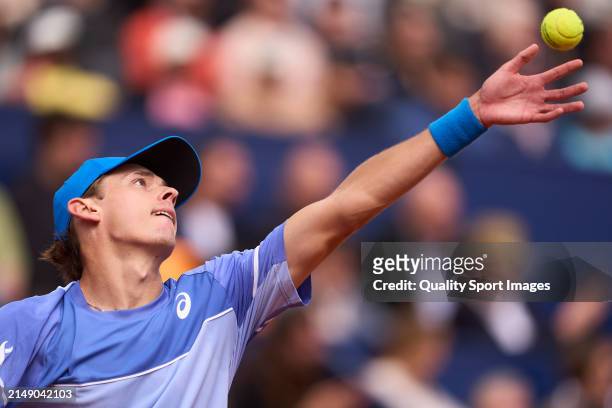 Alex de Minaur of Australia serves against Rafael Nadal of Spain in the second round during day three of the Barcelona Open Banc Sabadell at Real...