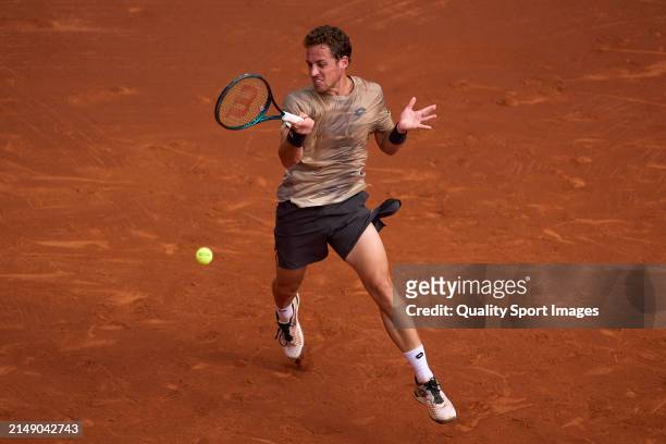 Roberto Carballes of Spain plays a forehand shot against Lorenzo Musetti of Italy in the second round during day three of the Barcelona Open Banc...