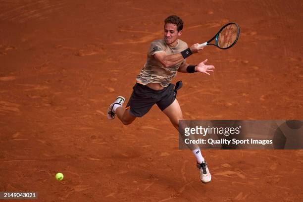 Roberto Carballes of Spain plays a forehand shot against Lorenzo Musetti of Italy in the second round during day three of the Barcelona Open Banc...