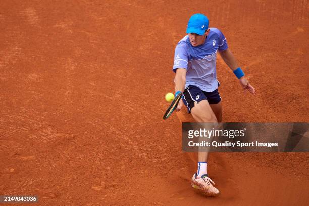 Alex de Minaur of Australia plays a backhand against Rafael Nadal of Spain in the second round during day three of the Barcelona Open Banc Sabadell...