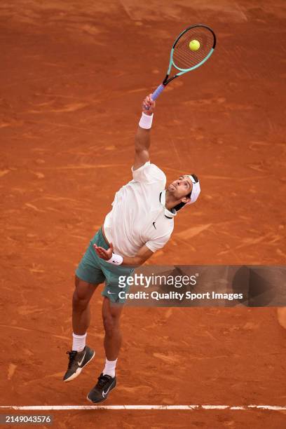 Lorenzo Musetti of Italy serves against Roberto Carballes of Spain in the second round during day three of the Barcelona Open Banc Sabadell at Real...
