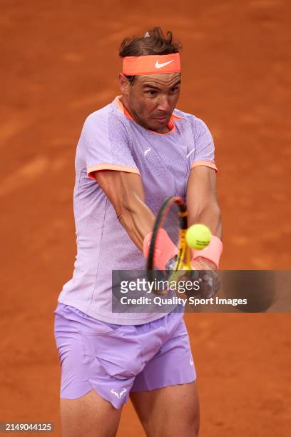 Rafael Nadal of Spain plays a backhand shot against Alex de Minaur of Australia in the second round during day three of the Barcelona Open Banc...