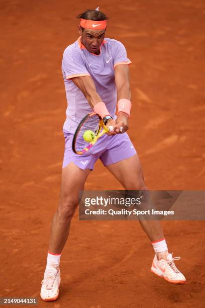 Rafael Nadal of Spain plays a backhand shot against Alex de Minaur of Australia in the second round during day three of the Barcelona Open Banc...