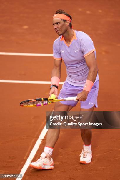 Rafael Nadal of Spain serves against Alex de Minaur of Australia in the second round during day three of the Barcelona Open Banc Sabadell at Real...