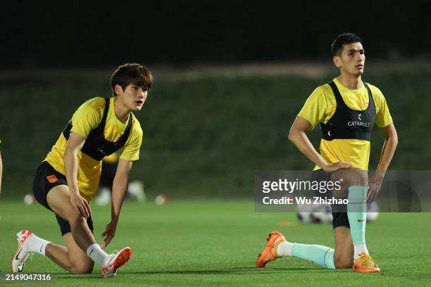 Liu Zhurun and Ablahan Haliq of Team China attend a training session ahead of the the AFC U23 Asian Cup 2024 Group B match between China and South...